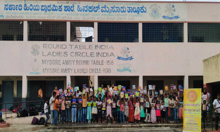 Shree Sadguru Seva Trust Empowers Students with Free Book Distribution at Government Higher Primary School, Hinakal Mysore